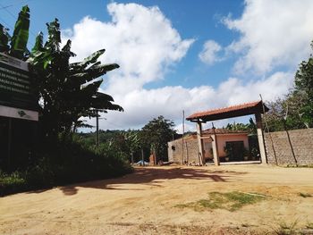 Exterior of building by trees against sky