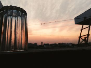 Low angle view of silhouette field against sky during sunset