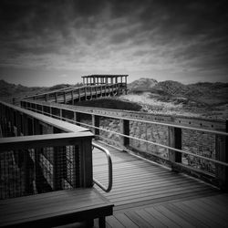 View of bridge against cloudy sky