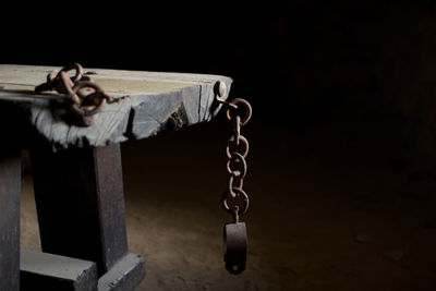 Close-up of chain hanging on rope