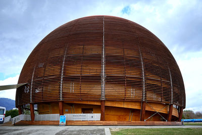 Low angle view of building against cloudy sky