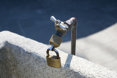 Close-up of tap locked with padlock