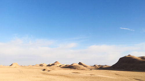 Scenic view of desert against sky