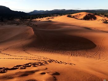 Scenic view of desert against clear sky