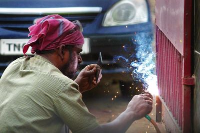 Side view portrait of man working