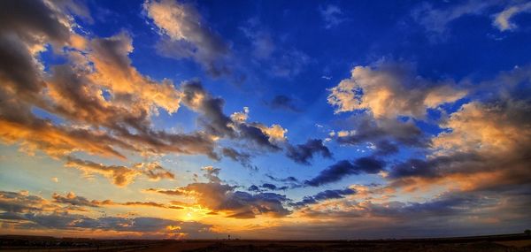 Low angle view of dramatic sky during sunset