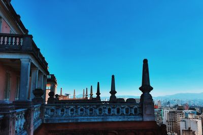 View of buildings against blue sky