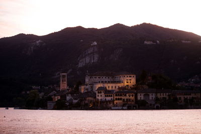 Calm sea with mountain range in background