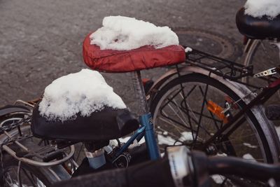 Snow covered bicycle in winter