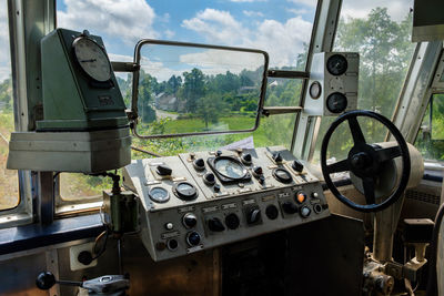 View of train through windshield of car