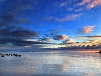 Scenic view of sea against sky at sunset