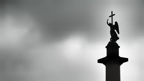 Low angle view of statue against sky