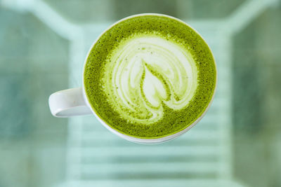 Close-up of coffee or green tea cup on table