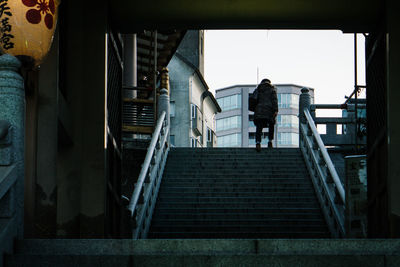 Rear view of people on staircase