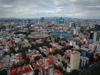 High angle view of modern buildings against sky in city