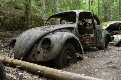 Abandoned car in forest