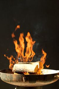 Close-up of fire burning in wood