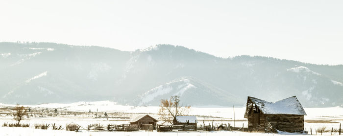 Scenic view of snow covered mountains against sky