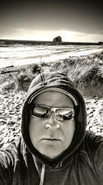 Portrait of boy in sunglasses at beach