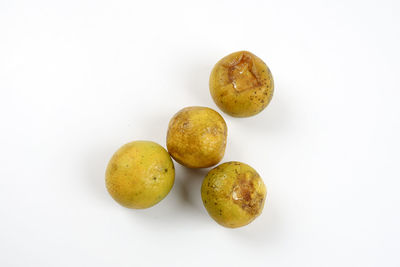 High angle view of fruits against white background