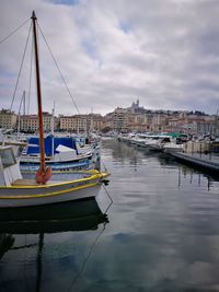 Boats moored at harbor