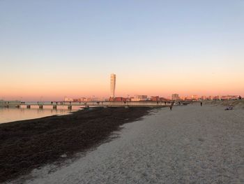 Scenic view of sea against clear sky during sunset