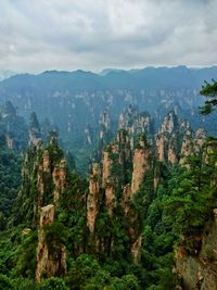 Scenic view of rock formations at zhangjiajie national forest park against cloudy sky