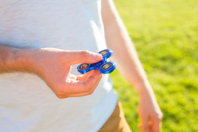 Low section of man playing with ball