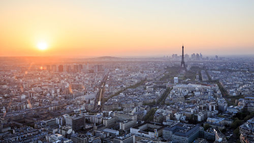 High angle view of city buildings during sunset