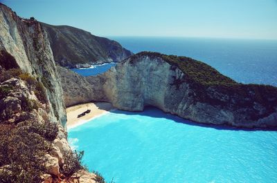 Scenic view of sea against clear blue sky