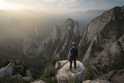 One man standing on a cliff on his way to nido de aguiluchos.