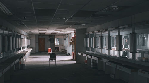 Rear view of man standing in abandoned building