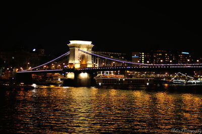 Illuminated suspension bridge at night