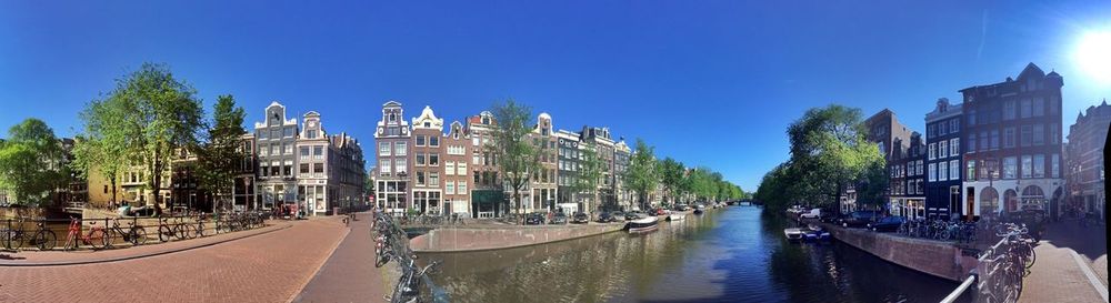 Buildings against clear sky with waterfront