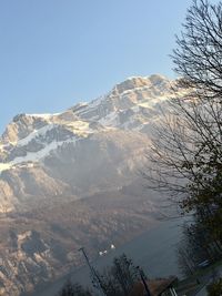 Scenic view of snowcapped mountains against clear sky