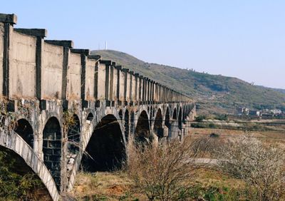 Arch bridge against clear sky