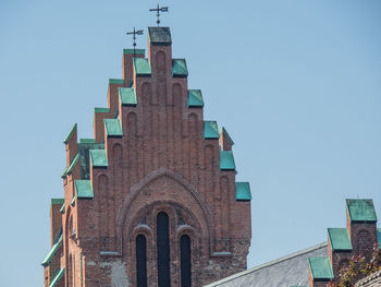 Low angle view of building against clear blue sky