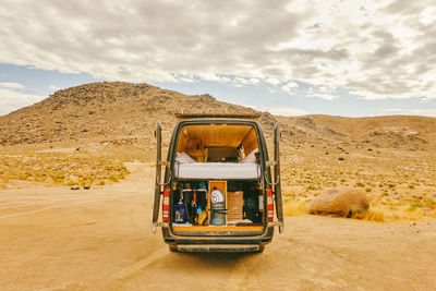 View of car on desert land