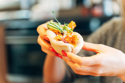 Close-up of hand holding food