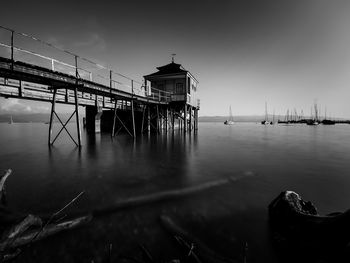 Pier over sea against sky