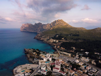 High angle view of townscape by sea