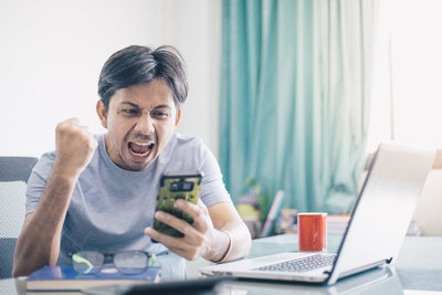 Young man using mobile phone