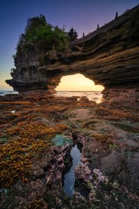 Scenic view of rock formations against sky