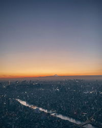 High angle view of city against sky during sunset