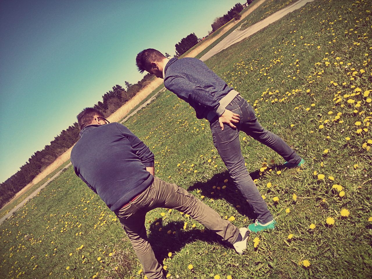 lifestyles, leisure activity, full length, sunlight, casual clothing, men, shadow, standing, sky, blue, field, day, outdoors, childhood, nature, clear sky, sunny, low angle view