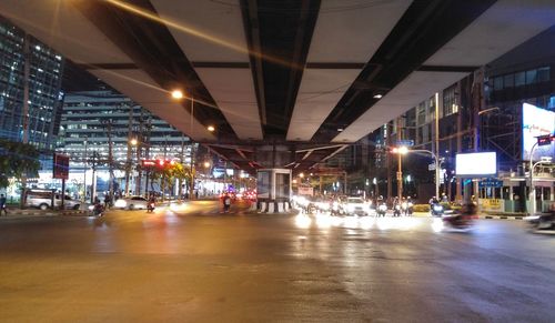 Illuminated city street at night