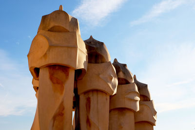 Low angle view of statue against sky