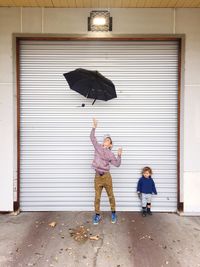 Children playing with umbrella