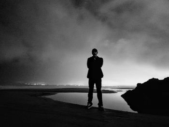 Full length of man standing on beach