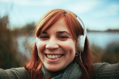 Close-up portrait of a smiling young woman